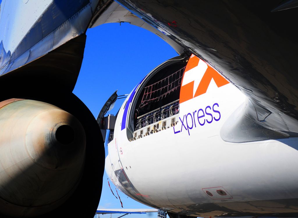 Airbus A310 (N435FE) - Fed Ex opening front loading cargo door. Fed Ex operations area Mather field., Rancho Cordova, CA.