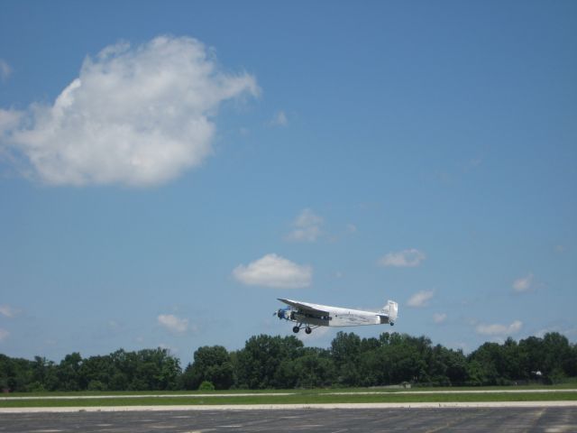 Ford Tri-Motor (NAC8407) - Ford Trimotor taking off from Bowman Field.