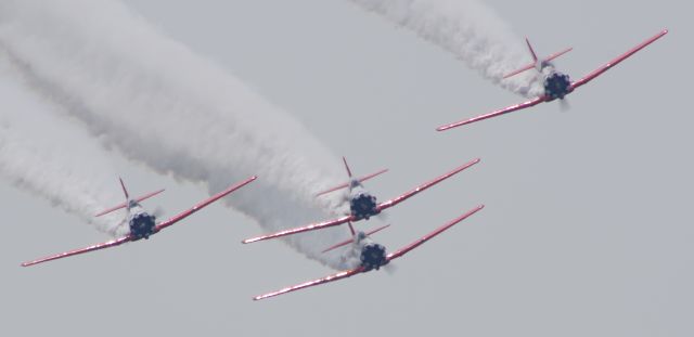 North American T-6 Texan (N7462C) - GREENWOOD LAKE AIRPORT, WEST MILFORD, NEW JERSEY, USA-JUNE 11, 2023: Seen by RF at the 2023 Greenwood Lake Airshow was the Aeroshell Aerobatic Team. This team flies four AT-6 Texans. Here we see the team during their performance.