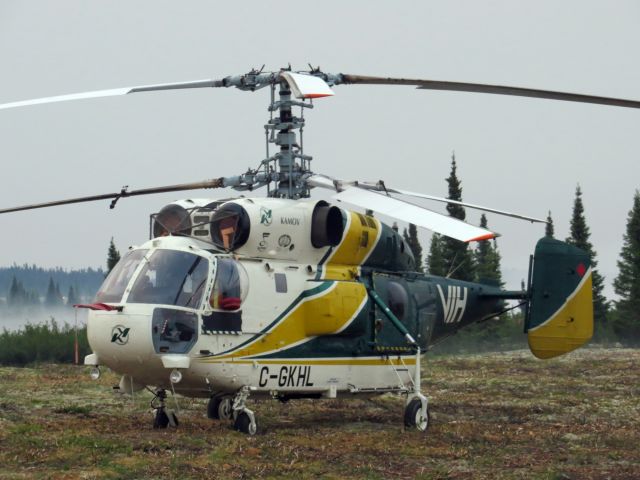 KAMOV Ka-32 (C-GKHL) - C-GKHL, a VIH Kamov KA-32 getting some rest in the field early in the morning. This rare sight was flying on a wildland fire contract for the SOPFEU. Poste-Montagnais (Off airport), Québec - July 2013