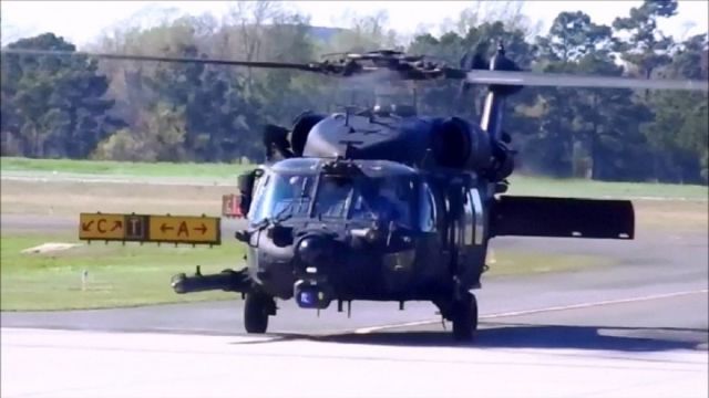 — — - US Army UH-60 Blackhawk taxiing to Ramp at Grand Strand Airport (KCRE) on 3/31/2015. Look close as the Pilot in your right window is signalling a swing in the Tailboom to the left.