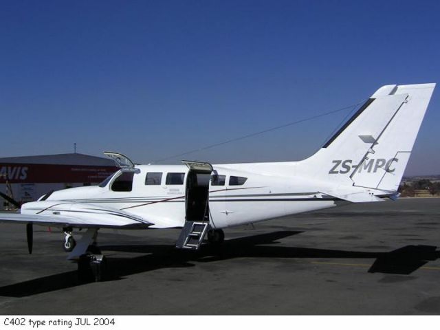 Cessna 402 (ZS-MPC) - At Lanseria, South Africa.