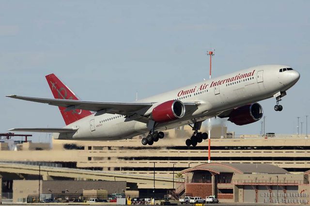 Boeing 777-200 (N927AX) - Omni Air International Boeing 777-222 N927AX departing from Sky Harobor with a West Virginia Mountaineers football charter bound for Pittsburgh International Airport on January 3, 2016. It first flew on August 15, 1997. Its construction number is 26943. It was delivered to United as N709UA on August 28, 1997. Air India registered it as VY-AIJ on February 17, 2005. Omni Air International registered it as N927AX on May 20, 2011. 