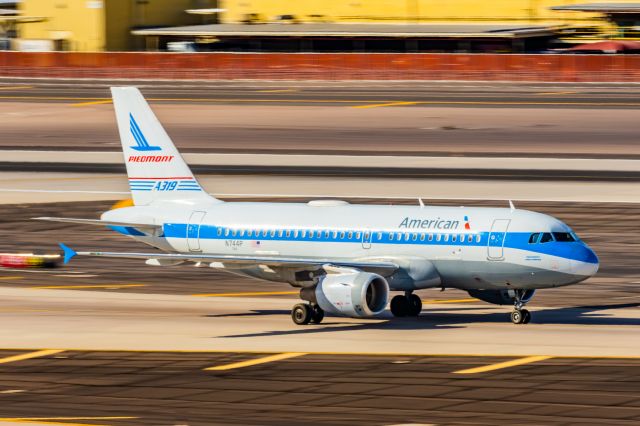 Airbus A319 (N744P) - An American Airlines A319 in Piedmont retro livery taxiing at PHX on 2/28/23. Taken with a Canon R7 and Canon EF 100-400 L ii lens.