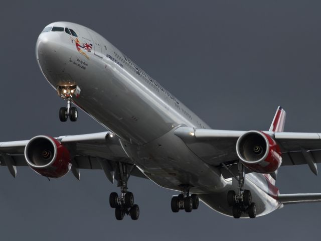 Airbus A340-600 — - The metalic colour scheme of this Virgin Atlantic A340-600 against the grey sky makes the shot almost appear black and white.