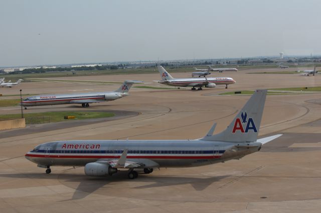 Boeing 737-800 (N825NN) - 081513 taxiing out, MD82 N578AA, B752, and several more MD80s