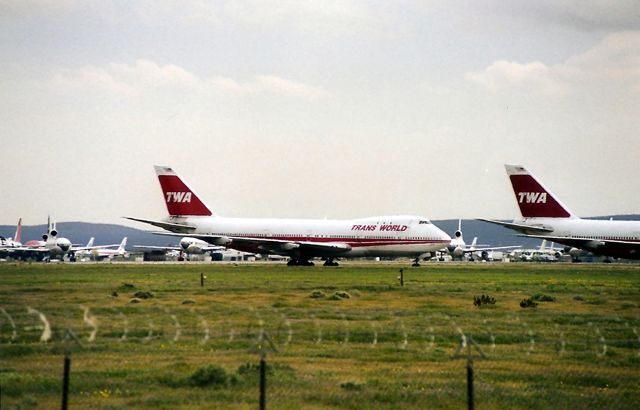 Boeing 747-200 — - KMHV - unk date - but quite awhile ago - but this was on my way to Laughlin for the UFO show - and MHV was a packed graveyard back then. I walked way out through a field to get these photos - didnt think their might be rattlesnakes - didnt see any but won't walk out here ever again.