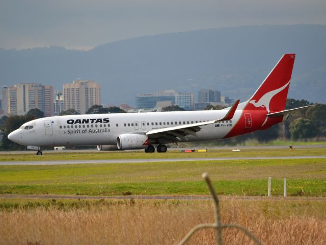 Boeing 737-800 (VH-VXR) - On taxi-way heading for Terminal 1 after landing on runway 23. Wednesday 4th July 2012.