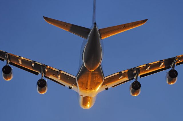 Airbus A380-800 (F-HPJC) - The intense glow of the setting sun paints an Air France operated Airbus A380-861 super jumbo golden, as it takes to the skies after departure from the Los Angeles International Airport, LAX, in Westchester, Los Angeles, California