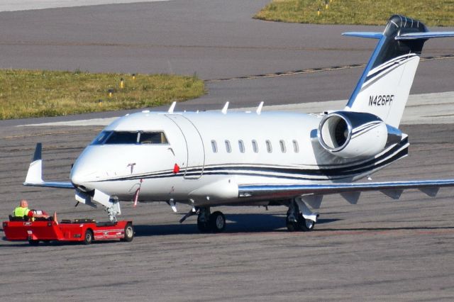 Canadair Challenger (N426PF) - Privately owned 2002 Challenger 600 being towed across the Signature Flight Support ramp at KTPA on 12-11-2020