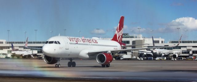 Airbus A320 (N285VA) - Inaugural flight on 3-15-2016 from SFO taxiing to its gate. Its getting wet from a water arch provided by Denver Fire to celebrate.