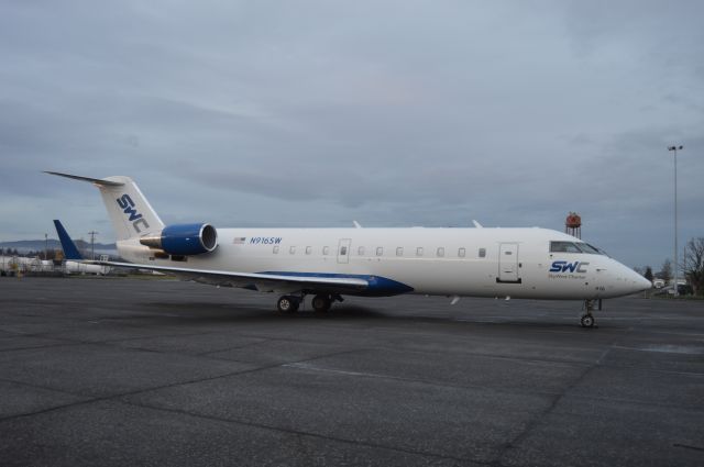 Canadair Regional Jet CRJ-200 (N916SW) - One of SkyWest Charter's CRJ-200s parked on the ramp at Corvallis (KCVO/CVO). Arrived from nearby Eugene the day prior as SCW3085 to sit on standby at Corvallis.