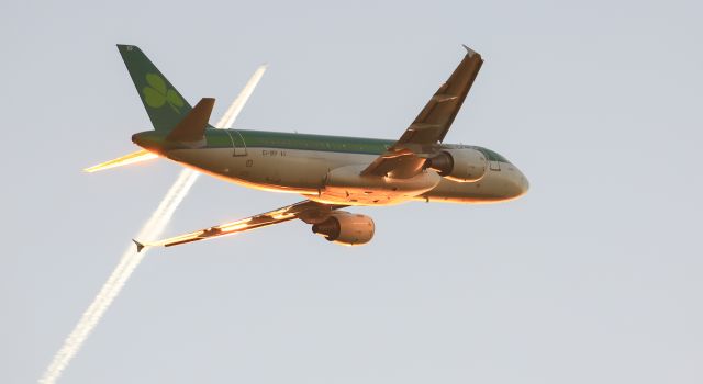 Airbus A320 (EI-DEF) - Out of EIDW into the winter sunshine....with a Ryanair B737 high above.