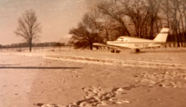 Piper Cherokee (N5799F) - Not the best photo...taken with an old Kodak 110 at IL52, Carthage, IL in February of 1978. N5799F was owned by Stan Little of LaHarpe, IL.