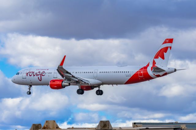 Airbus A321 (C-FJOU) - An Air Canada Rouge A321 landing at PHX on 2/26/23. Taken with a Canon R7 and Tamron 70-200 G2 lens.