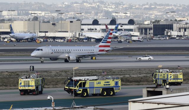 Embraer 175 (N200NN) - After making an emergency landing on 25L, this aircraft sat on the runway for almost 20 minutes with the fire department on stand by.