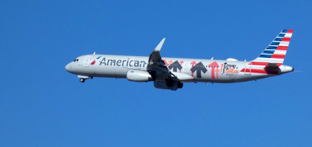 Airbus A321 (N162AA) - Shortly after departure is this 2016 American Airlines "Stand up to Cancer" livery Airbus 321-231 in the Winter of 2022.