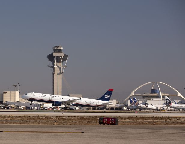 Airbus A321 (N154UW) - Morning takeoff from LAX runway 25R, Los Angeles, California USA