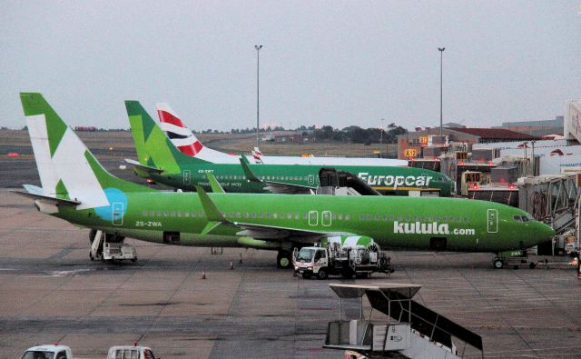 Boeing 737-800 (ZS-ZWA) - Taken very late afternoon - not great quality but to show difference in paint jobs