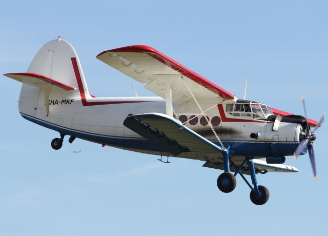 — — - An Antonov AN-2 visiting from Hungary performs a flypast at Duxford.