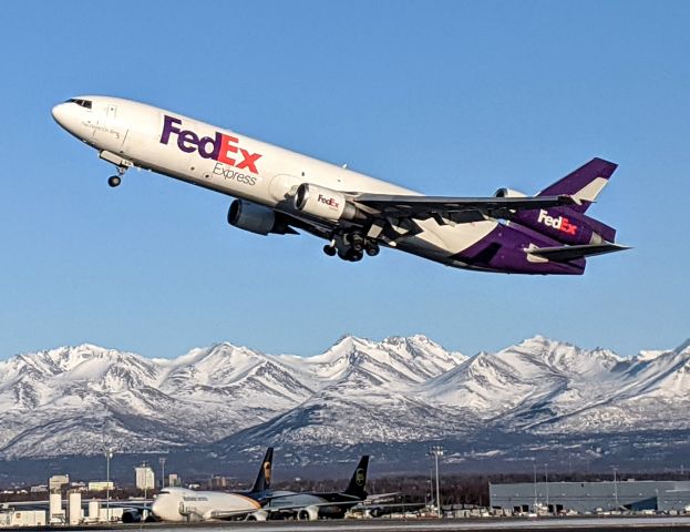 Boeing MD-11 (N615FE) - Takeoff viewed from West side of N-S runway