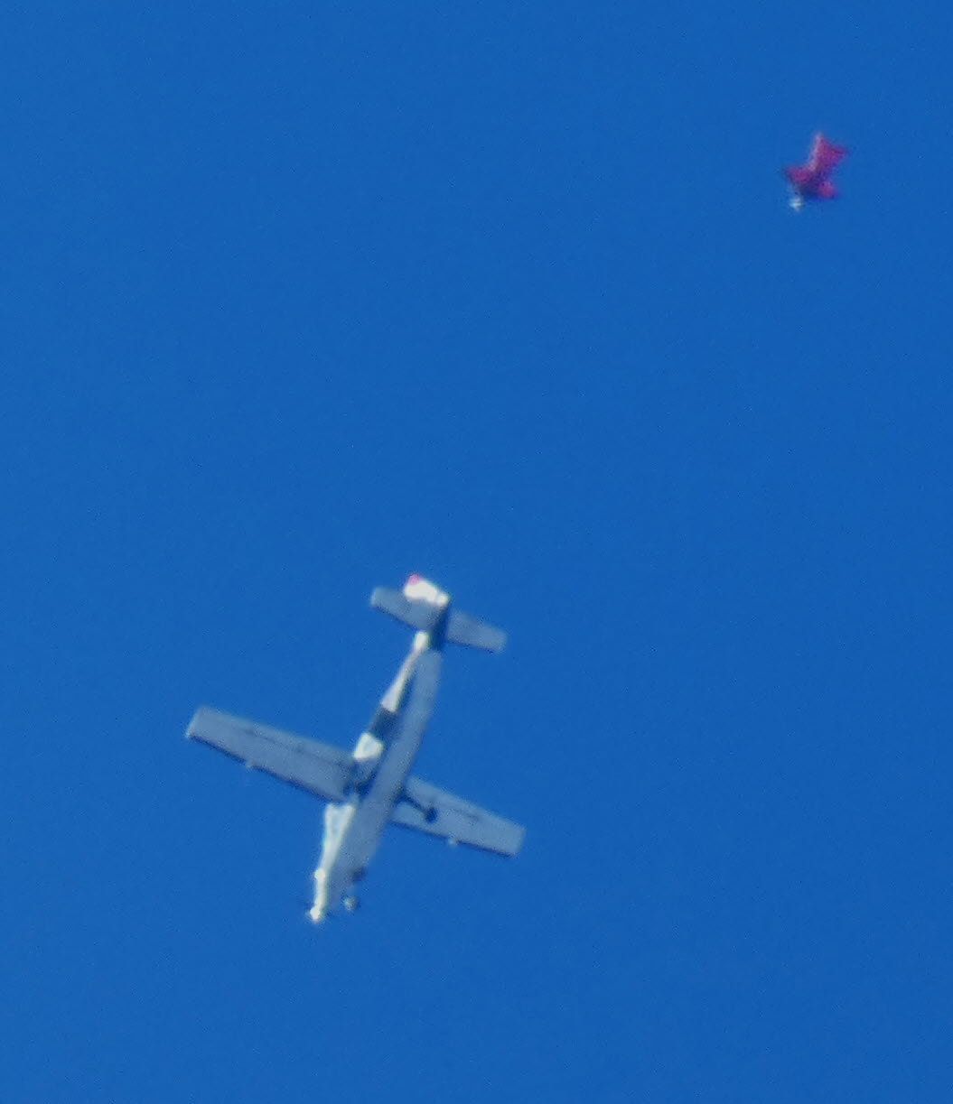 Cessna Caravan (N626LM) - Shown here is a 1998 Cessna 208B Grand Caravan around 13K-14K feet and one of the Skydive Sussex Skydivers departure in the Autumn of 2024. Appears that is all atmosphere that prevents a sharp Picture. 