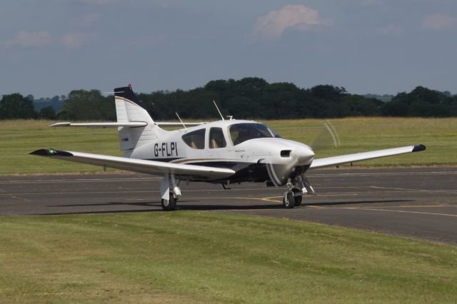 Rockwell Commander 114 (G-FLPI) - Taxiing back from the active