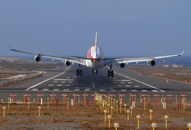 Airbus A340-300 — - Landing on runway 03L.