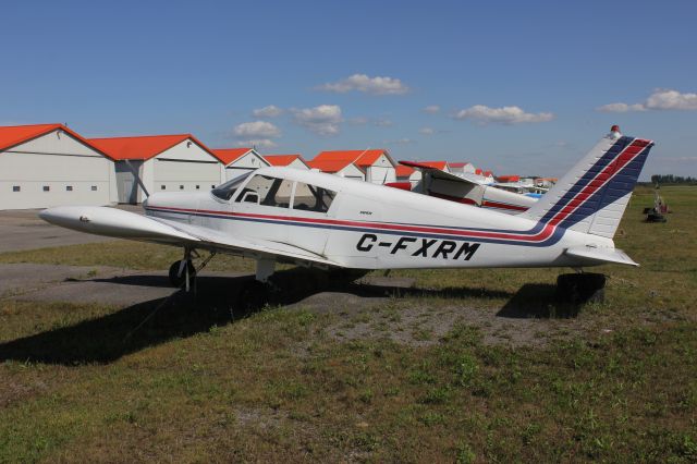 Piper Cherokee (C-FXRM) - C-FXRM Piper PA-28-140 stationné à laéroport de Joliette CSG3 QC. le 12-08-2018