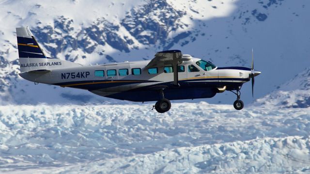 Cessna Caravan (N754KP) - Walking the dog in the Mendenhall Wetlands.  N754KP landing at JNU, with the Mendenhall Glacier in the background.