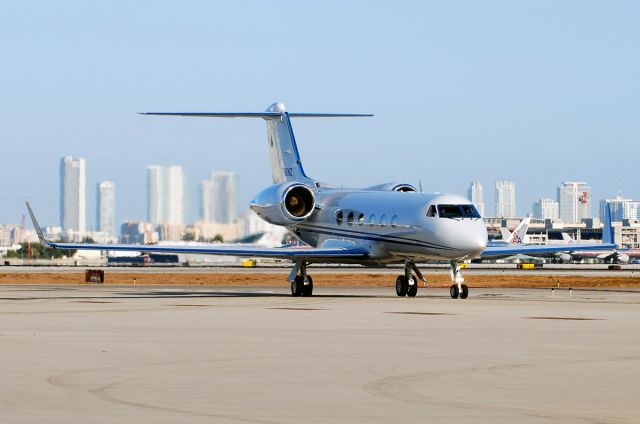 Gulfstream Aerospace Gulfstream IV (N12NZ) - Taxiing with downtown Miami as the backdrop