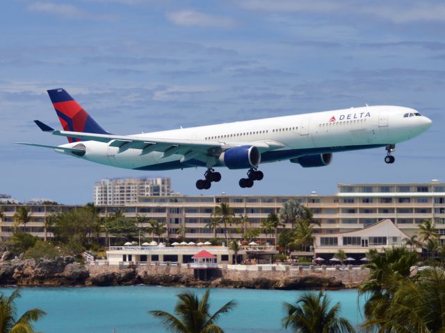 Airbus A330-300 (N812NW) - So the sad story is that the Carnival Dream cruise liner broke down here in St. Maarten, so the company decided to fly the passengers out after 2 days here on the island. The good news is that we got a lot of Delta heavies. Delta 8864 arrives to get the next batch of passengers to Orlando