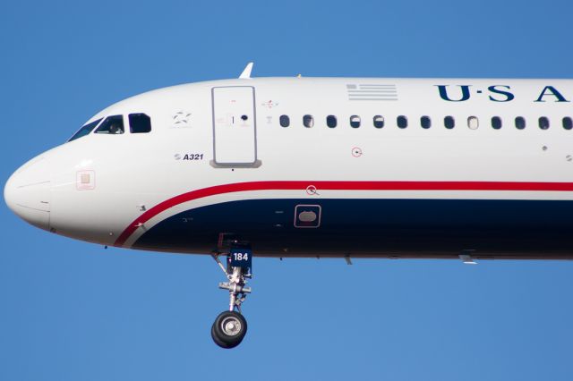 Airbus A321 (N184US) - Cactus 700 short final for runway 27 right.