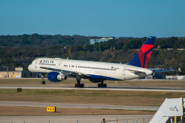 Boeing 757-200 (N666DN) - N666DN departing runway 31L. Most likely carrying a NBA team of some sort.