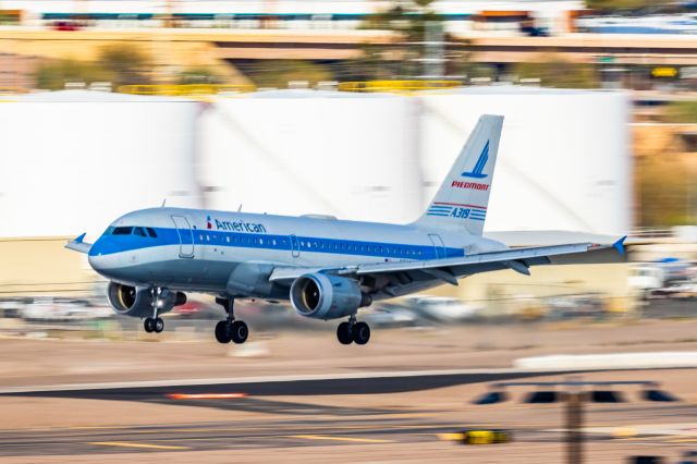 Airbus A319 (N744P) - An American Airlines A319 in Piedmont retro livery landing at PHX on 2/28/23. Taken with a Canon R7 and Canon EF 100-400 L ii lens.