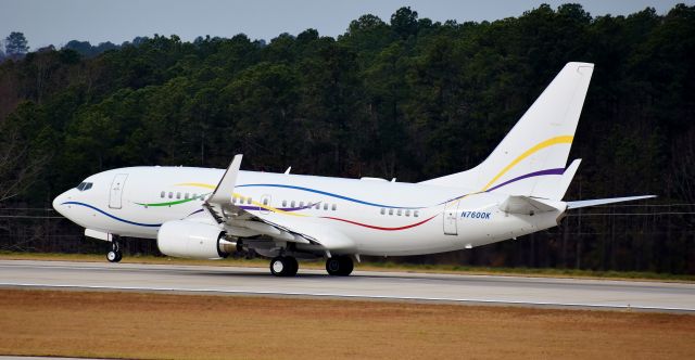 Boeing 737-700 (N7600K) - The SAS BBJ rotating from 23R, always a fun sight.  From the RDU observation deck 12/23/17.