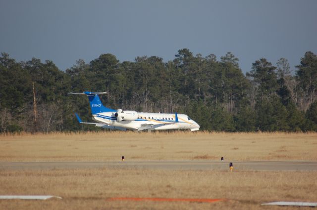 Embraer ERJ-135 (N617WA) - Slowing down to turn on taxiway F at Lone Star.