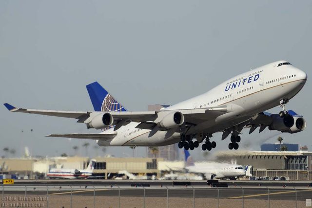 Boeing 747-400 (N128UA) - United Boeing 747-422 N128UA departing from Sky Harobor with an Ohio State football charter bound for Rickenbacker International Airport on January 2, 2016. It first flew on May 1, 2000. It carries construction number 30023. It was delivered to United on May 12, 2000. 