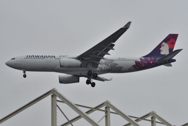 Airbus A330-200 (N384HA) - 23-L Arriving in the pouring rain with a load of Afghan refugees from IAD. Going to Camp Atterbury. 09-04-21