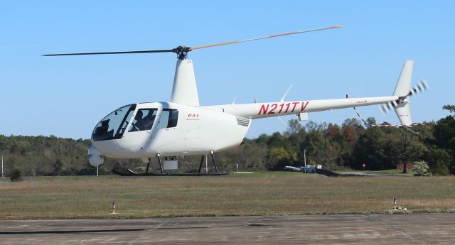 Robinson R-44 (N211TV) - A Robinson R-44 Raven II Newscopter departing Northeast Alabama Regional Airport, Gadsden, AL - November 2, 2019.