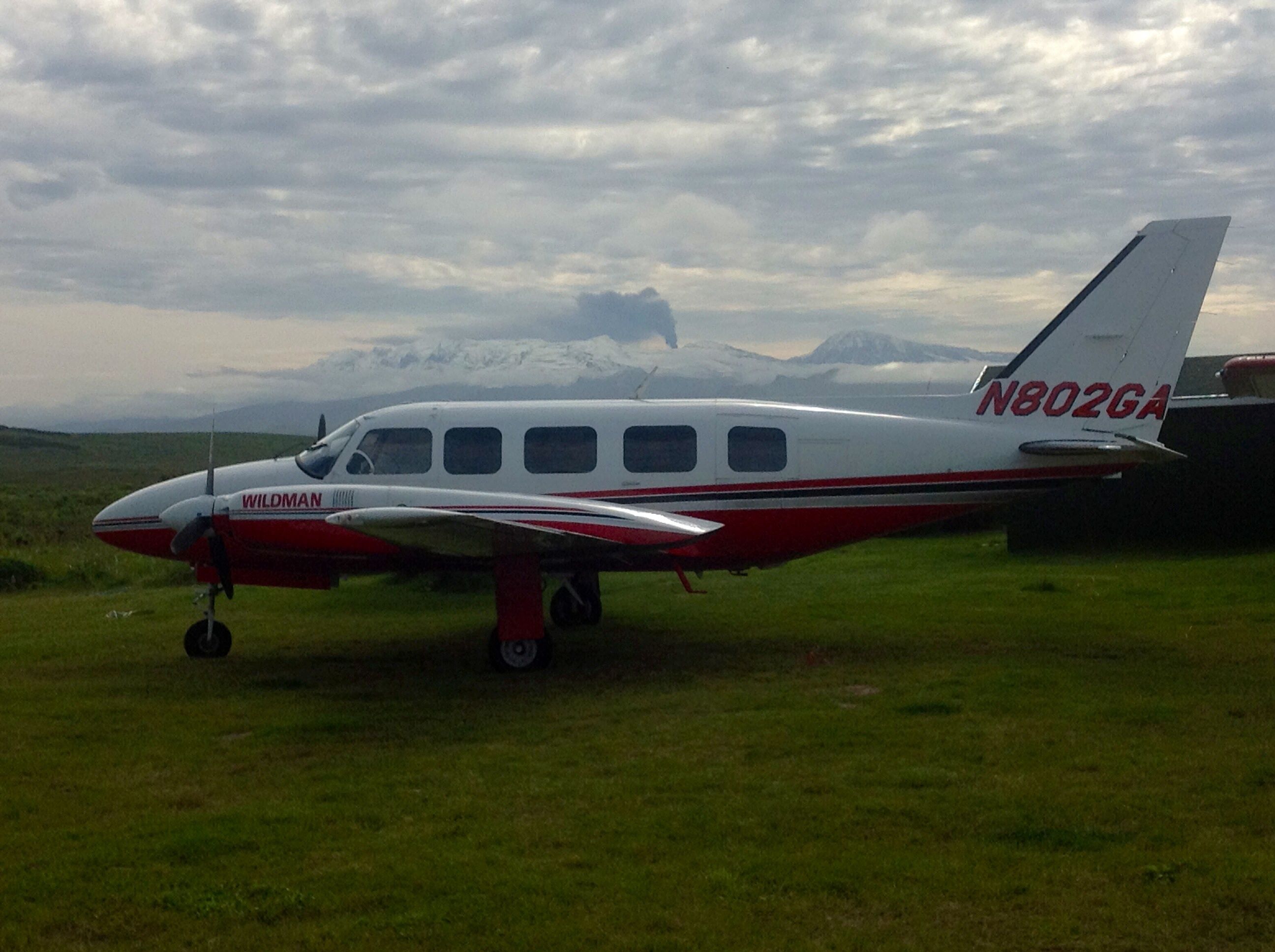 Piper Navajo (N802GA) - N802GA at Wildman Lake Lodge during minor eruption, Mt. Veniaminof Volcano