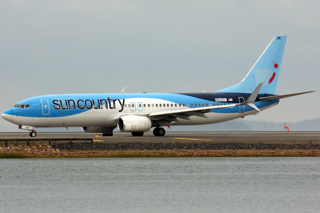 Boeing 737-800 (N844SY) - Sun Country B738 in TUIfly livery departing Boston Logan on 8/11/22.