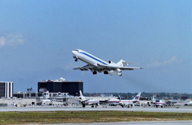 BOEING 727-200 (LX-MMM) - KLAX - apprx March 1989 Private 727-200 departing 25L for points east, this jet delv new to HapagLloyd July 1980 Line: 1640. Photo from the Imperial Terminal parking lot.