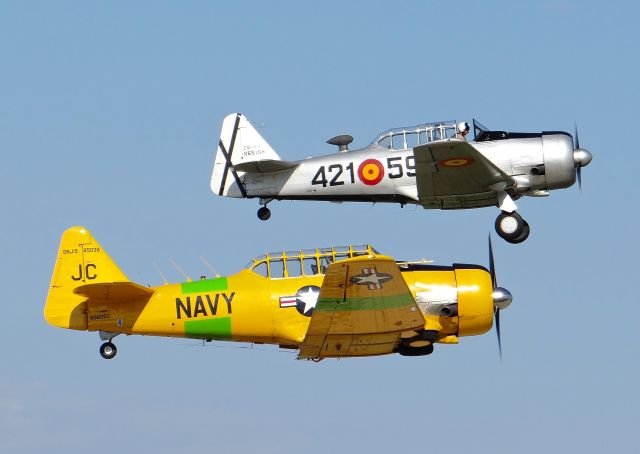 North American T-6 Texan (N651SH) - Two North American T6 Texans (N651SH) featured in the back) departing in formation at AirVenture 2015!