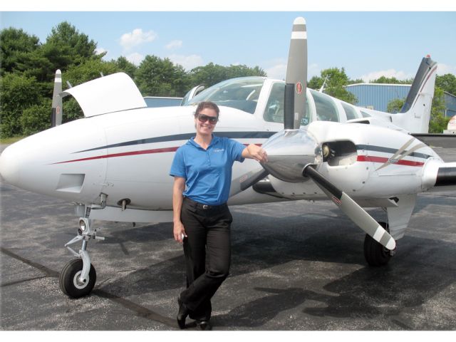 Beechcraft Baron (58) (N8111M) - Captain Angie Hartwell in Reliant Airs Baron BE58.