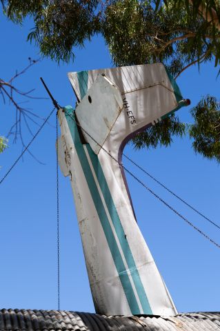 Cessna Skylane (VH-EFS) - The tail of EFS on the bar roof at Hillman Farm.