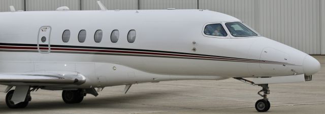 Cessna Citation Latitude (N525QS) - Shaka mahalo! The FO showing some love from the flight deck. br /br /EJA525. N525QS. 2016 Cessna 680A Citation Latitude. NetJets. KVPZ. 6/6/23.