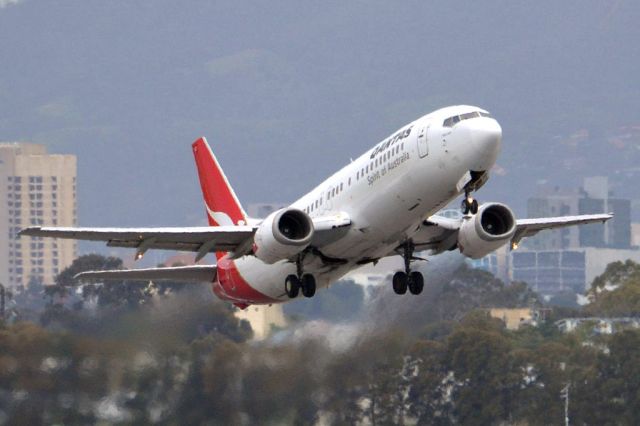 BOEING 737-400 (VH-TJZ) - Getting airborne off runway 23. Friday 5th October 2012.