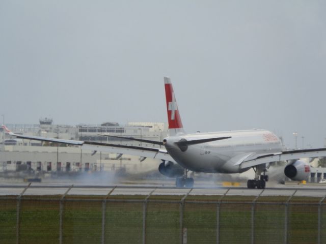 Airbus A330-300 (HB-JHF) - Tires smoke,screech and touchdown.