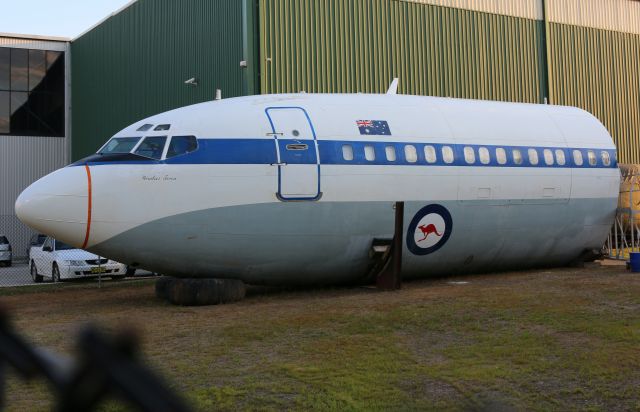 Boeing 707-100 (VH-EAG) - EAGs nose section resting at YWOL near OJA. Taken from the Perimeter fence with an 18-55mm